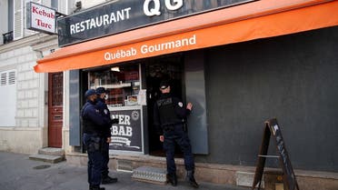 Police officers make a routine check in restaurants to verify compliance with COVID-19 sanitary measures in Vincennes, near Paris, amid the coronavirus outbreak in France, April 29, 2021. (Reuters)