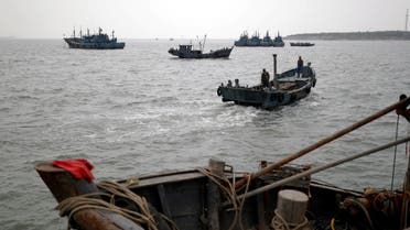 FILE PHOTO: Fishing boats are seen off the coast of Qingdao, Shandong province, China, following an oil spill in the Yellow Sea caused by a collision between tanker A Symphony and bulk vessel Sea Justice off Qingdao port, April 28, 2021. (File Photo: Reuters)