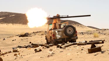 A Yemeni government fighter fires a vehicle-mounted weapon at a frontline position during fighting against Houthi fighters in Marib, Yemen March 9, 2021. Picture taken March 9, 2021. REUTERS/Ali Owidha