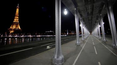 A view shows the deserted Pont de Bir-Hakeim Bridge and the Eiffel Tower during a nationwide curfew, from 6 p.m. to 6 a.m., due to restrictions against the spread of the coronavirus, in Paris, France. (Reuters)