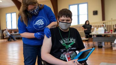 Thomas Macconnell, 16, who is on the autism spectrum, receives a coronavirus disease vaccine in Worcester, Pennsylvania, US, on April 29, 2021. (Reuters)