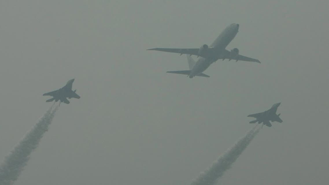 An Indian Navy Boeing P-8I Poseidon anti-submarine warfare and maritime patrol aircraft (C) flies in formation with Indian Navy MiG-29K carrier-capable multirole fighter aircraft during a flypast for the country's Republic Day Parade in New Delhi on January 26, 2015. (File photo: AFP)