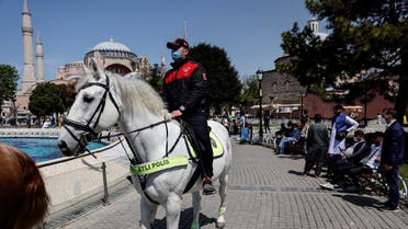 Mounted police officers ride around the Ayasofya-i Kebir Camii or Hagia Sophia Grand Mosque during a nationwide “full closure” until May 17 including a continuous lockdown amid the spread of the coronavirus, in Istanbul, Turkey, on April 30, 2021. (Reuters)