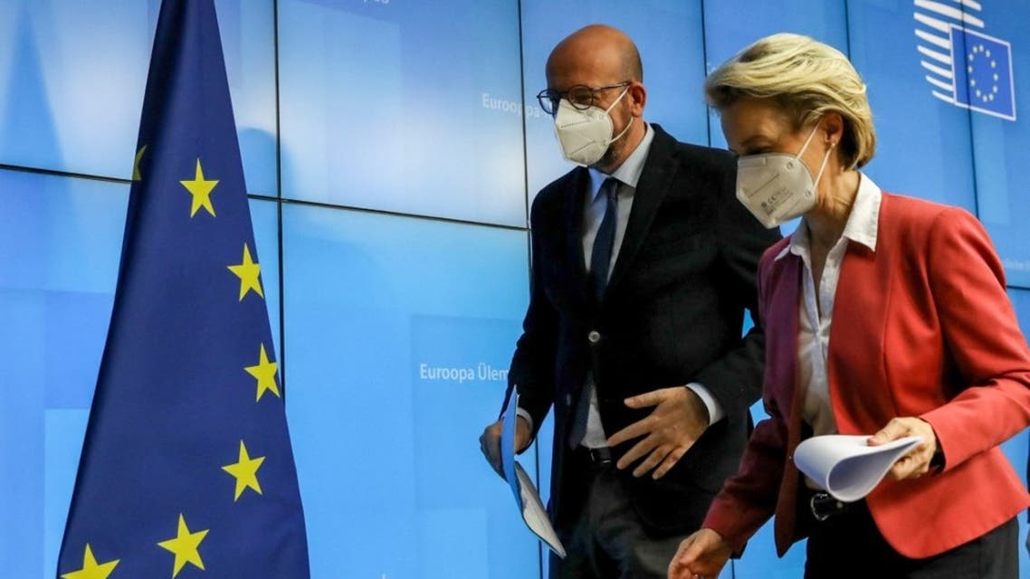 European Commission President Ursula von der Leyen (R) and European Council President Charles Michel leave after a joint press conference in Brussels, on February 25, 2021. (AFP)