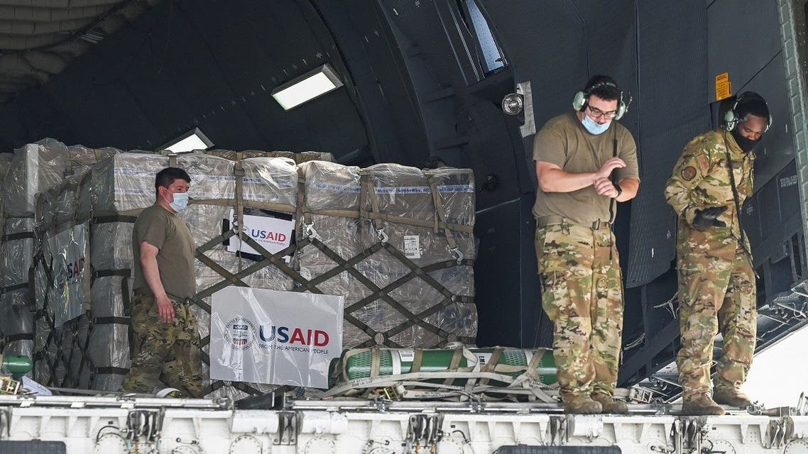 US army personnel prepare to unload coronavirus relief supplies from the U.S. at the Indira Gandhi International Airport cargo terminal in New Delhi, India, on April 30, 2021. (Reuters)
