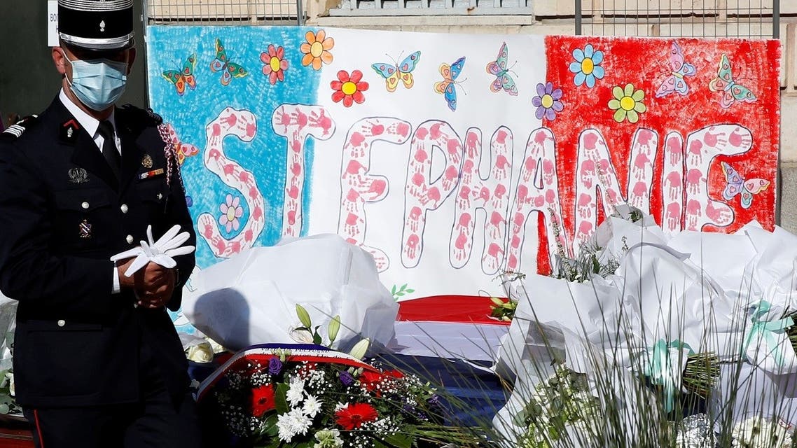 French police pay tribute to the police administrative worker, killed by a 36-year-old radicalised attacker last Friday, in front the city hall in Rambouillet near Paris, France, on April 26, 2021. (Reuters)