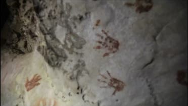 Various of hand prints on cave that are reportedly 1,200 years old. (Reuters)