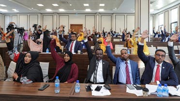 Somali legislators of the lower house of parliament raise their hands to vote to extend President Mohamed Abdullahi Mohamed's term for another two years to let the country prepare for direct elections, in Mogadishu, Somalia April 12, 2021. (Reuters)