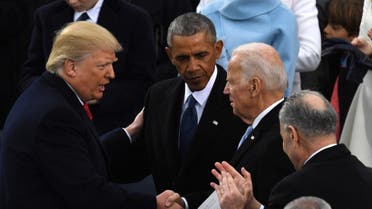 Former US President Donald Trump shakes hands with former US President Barack Obama and then former VP Joe Biden after being sworn in, Jan. 20, 2017. (AFP)