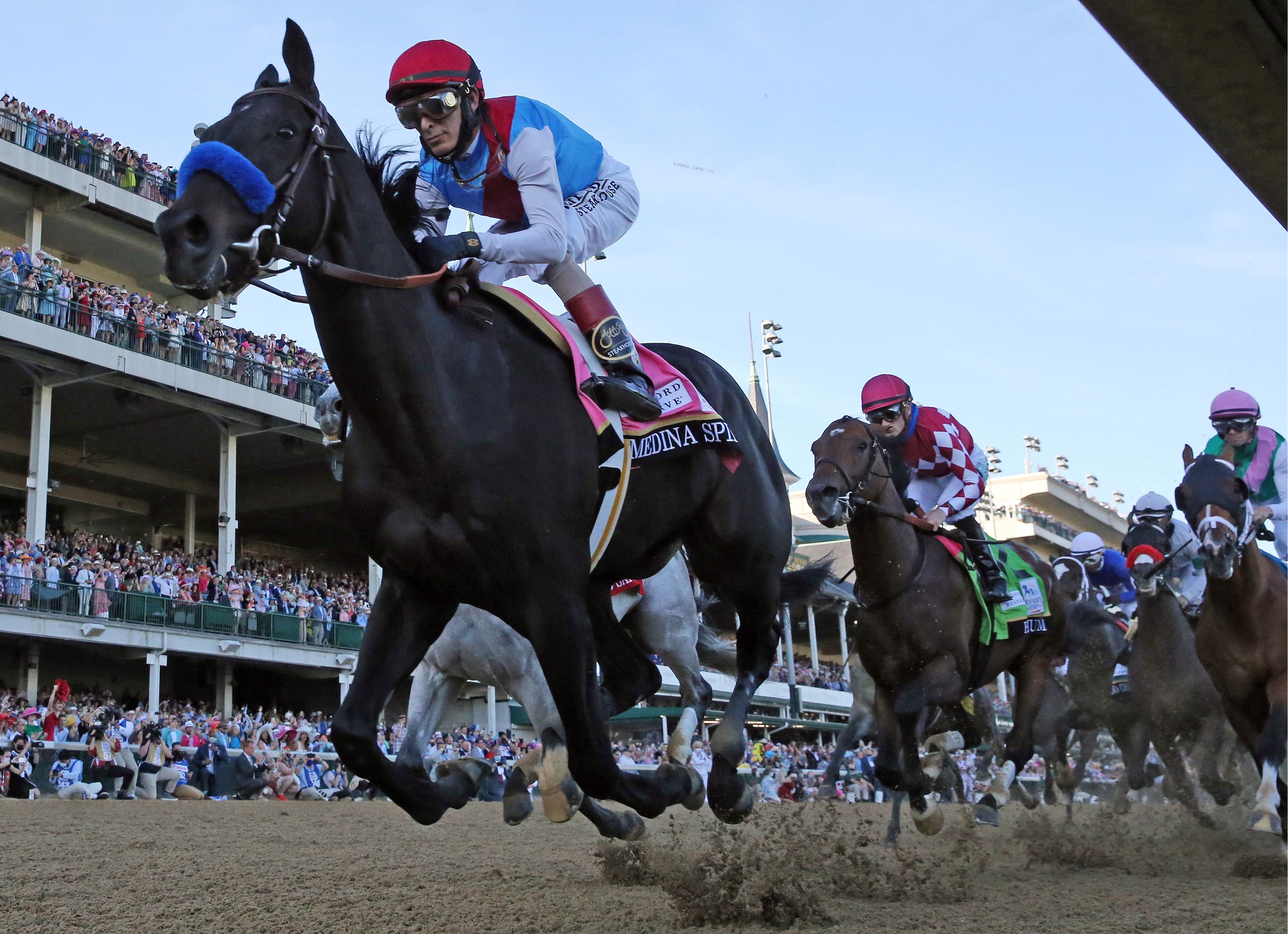 John Velazquez guides Medina Spirit to the front of the pack during 147th running of the Kentucky Derby at Churchill Downs. (Reuters)