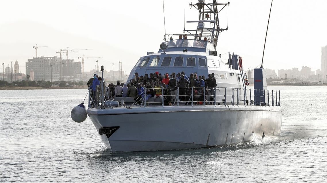 Migrants arrive at the naval base in the Libyan capital of Tripoli on April 29, 2021 after the coastguard intercepted an inflatable boat carrying 99 Europe-bound migrants off its west coast. (Mahmud Turkia/AFP)