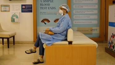 A woman waits to be vaccinated for the coronavirus disease (COVID-19) at a hospital, in New Delhi, India, May 1, 2021. REUTERS/Adnan Abidi