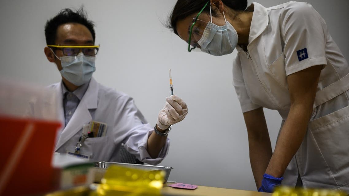 A nurse makes an inspection after a medical worker filled a syringe with a dose of the Pfizer-BioNTech Covid-19 vaccine as Japan launches its inoculation campaign at the Tokyo National Hospital in Kiyose, Tokyo prefecture on February 17, 2021. (File photo: AFP)