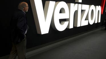 FILE PHOTO: A man stands next to the logo of Verizon at the Mobile World Congress in Barcelona, Spain, February 26, 2019. (File Photo: Reuters)