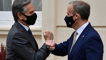 Britain's Foreign Secretary Dominic Raab (R) greets U.S. Secretary of State Antony Blinken by tapping arms with him as he arrives for their bilateral meeting in London, Britain May 3, 2021 during the G7 foreign ministers meeting. (Reuters)