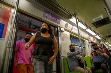 People board a metro wagon in Mexico City on May 4, 2021. Commuters riding Mexico City's metro just a day after one of its worst ever accidents said they worried for their safety but had little choice other than to use the network. At least 23 people died and dozens were injured after an elevated subway line collapsed, authorities said. (File photo: AFP)