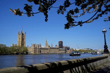 The Union flag flutters in the breeze on top of the Victoria Tower, part of the Palace of Westminster seen from the south bank of the River Thames in central London on April 20, 2020. (AFP)