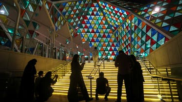 Visitors take pictures during 'Noor Riyadh' festival of light, in Riyadh, Saudi Arabia March 19, 2021. Picture taken March 19, 2021. REUTERS/Ahmed Yosri