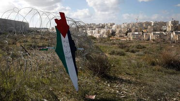 A representation of a map with the colors of the Palestinian flag in the village of Bilin in the Israeli-occupied West Bank, Jan. 31, 2020. (Reuters)