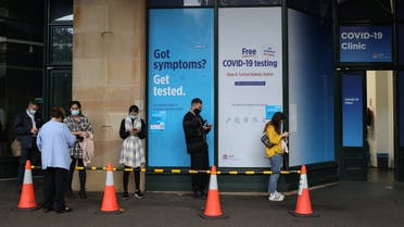 People wait in line at a coronavirus disease (COVID-19) testing clinic in the city centre after new cases were reported in Sydney, Australia, May 6, 2021. REUTERS/Loren Elliott
