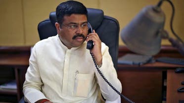 India's Oil Minister Dharmendra Pradhan speaks on phone during an interview with Reuters in New Delhi, India. (Reuters)