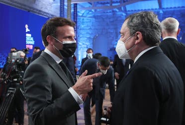 French President Emmanuel Macron, left, speaks with Italy's Prime Minister Mario Draghi during the opening ceremony of an EU summit at the Alfandega do Porto Congress Center in Porto, Portugal, on May 7, 2021. (AP)