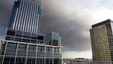 A plume of smoke hangs in the air behind buildings in the Canary Wharf district of London. (File photoReuters) 