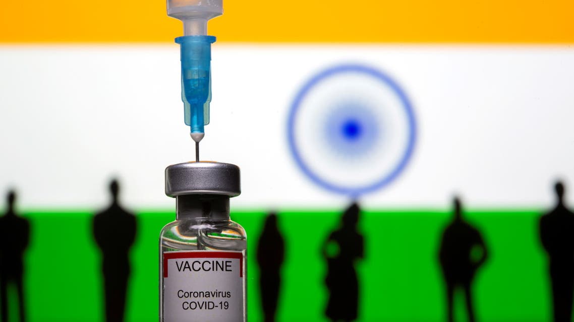FILE PHOTO: 3D-printed small toy figurines, a syringe and vial labelled coronavirus disease (COVID-19) vaccine are seen in front of India flag in this illustration taken May 4, 2021. (File Photo: Reuters)