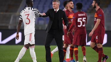 Manchester United manager Ole Gunnar Solskjaer shakes hands with Eric Bailly after the match, May 6, 2021. (Reuters)