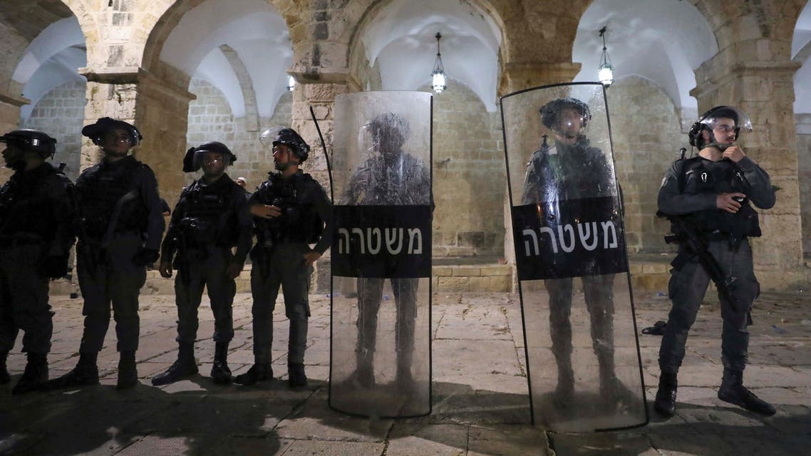 Israeli police keep guard during clashes with Palestinians at the compound that houses Al-Aqsa Mosque, known to Muslims as Noble Sanctuary and to Jews as Temple Mount, amid tension over the possible eviction of several Palestinian families from homes on land claimed by Jewish settlers in the Sheikh Jarrah neighbourhood, in Jerusalem's Old City, May 7, 2021. REUTERS/Ammar Awad