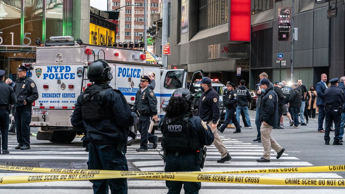 New York City police officers stand guard after a shooting incident in Times Square, New York, US, May 8, 2021. (Reuters)