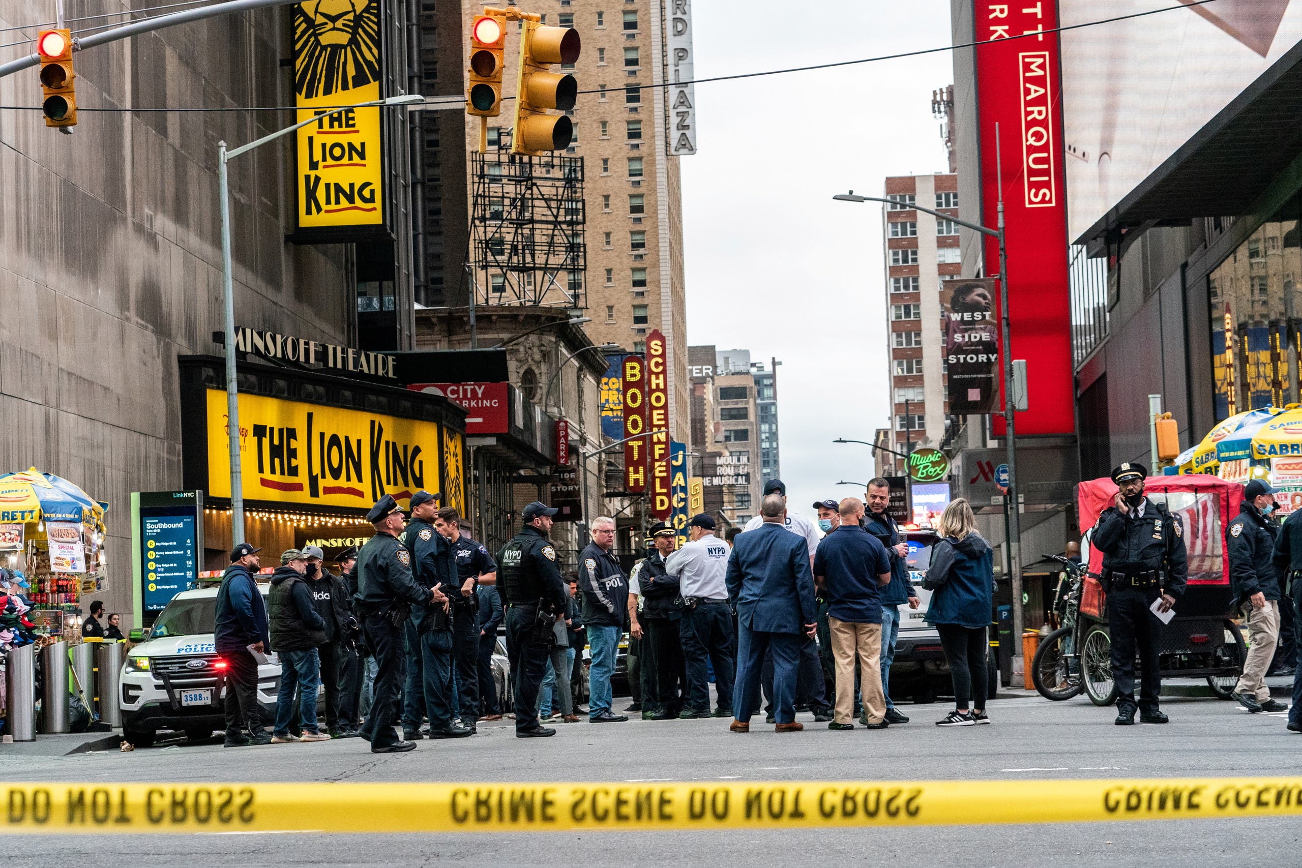 New York City police officers stand guard after a shooting incident in Times Square, New York, US, May 8, 2021. (Reuters)