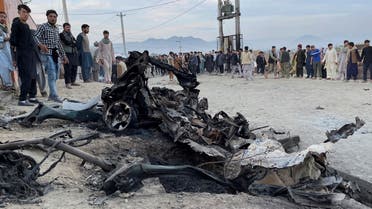 People stand at the site of a blast in Kabul, Afghanistan May 8, 2021. (Reuters)