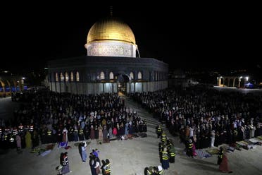 Palestinians pray in front of the Dome of the Rock on Laylat al-Qadr during the holy month of Ramadan, at the compound that houses Al-Aqsa Mosque, known to Muslims as Noble Sanctuary and to Jews as Temple Mount, in Jerusalem's Old City, May 8, 2021. (Reuters)