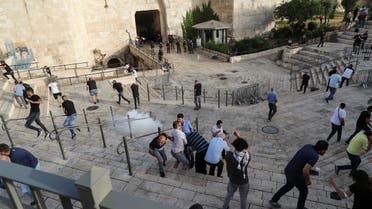 Palestinians disperse as a stun grenade fired by Israeli security forces explodes amid Israeli-Palestinian tension as Israel marks Jerusalem Day, at Damascus Gate just outside Jerusalem's Old City May 10, 2021. (Reuters)