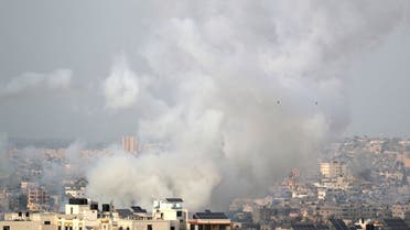 Smoke rises as rockets are launched by Palestinian militants into Israel, in Gaza on May 10, 2021. (Reuters)