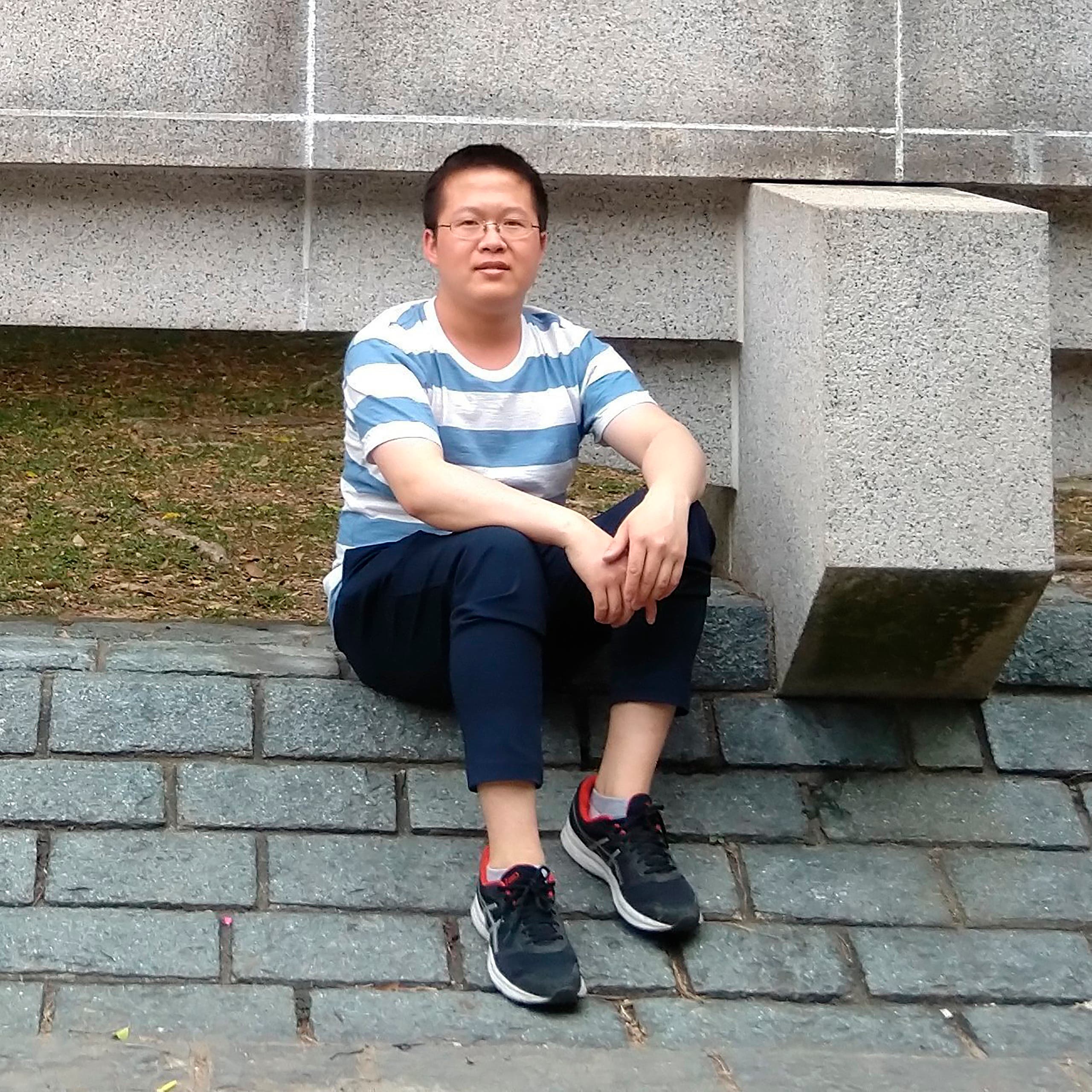 In this photo released by Chen Mei Family, Chen Mei poses for a photo in Hong Kong in 2018. More than a year after two young men, including Chen Mei, disappeared from their Beijing homes, they are set to be tried Tuesday, May 11, 2021 in a case that illustrates the Chinese government's growing online censorship and sensitivity to any criticism of its COVID-19 response. (Chen Mei Family via AP)