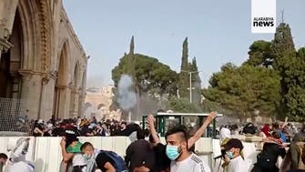 Israeli police throw stun grenades during clashes with Palestinians at Al-Aqsa mosque