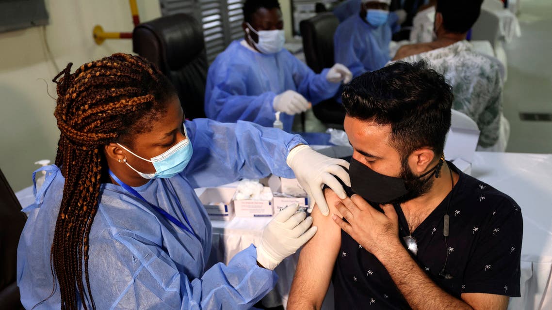 A healthcare worker administers a shot of China's Sinopharm COVID-19 vaccine to a man at the Guru Nanak Darbar Gurudwara (Sikh temple) in Dubai on February 28, 2021. (File photo: AFP)