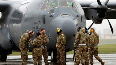 U.S. soldiers wearing protective face masks are seen in front of C-130 transport plane during a military drill amid the coronavirus disease (COVID-19) outbreak, at Yokota U.S. Air Force Base in Fussa, on the outskirts of Tokyo, Japan May 21, 2020. (File photo: Reuters)