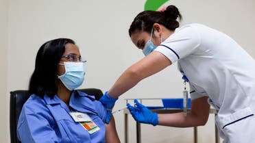 A handout picture taken by the Government of Dubai Media Office on December 23, 2020, shows a health worker administering a dose of the coronavirus vaccine to a nurse at a medical center in the Dubai Emirate. (File photo: AFP)