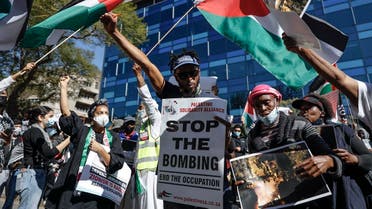 Demonstrators gather outside of the Israel Trade office in Sandton, Johannesburg, on May 11, 2021 during a protest against Israeli attacks on Palestinians in Gaza. (Guillem Sartorio/AFP)