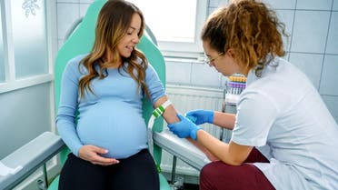 Pregnant woman having a blood test stock photo