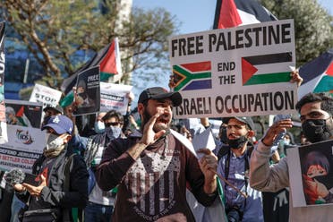 Demonstrators gather outside of the Israel Trade office in Sandton, Johannesburg, on May 11, 2021 during a protest against Israeli attacks on Palestinians in Gaza. (Guillem Sartorio/AFP)
