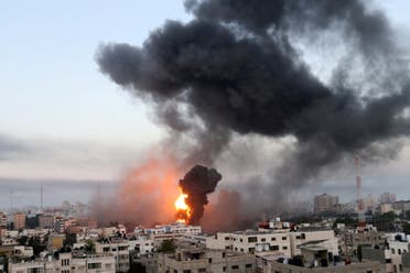Smoke and flames rise during Israeli air strikes amid a flare-up of Israeli-Palestinian violence, in Gaza May 12, 2021. (Reuters)