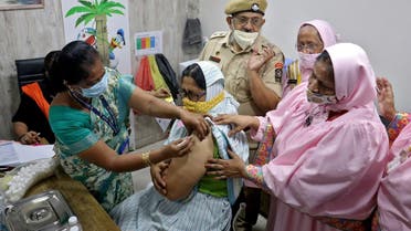 Monira Abbas Bhagasrala, 53, receives a dose of COVISHIELD, a coronavirus vaccine manufactured by Serum Institute of India, at a vaccination centre in Mumbai, India, on May 6, 2021. (Reuters)