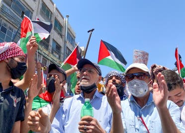 Demonstrators gesture during a protest to express solidarity with the Palestinian people, in downtown Amman, Jordan May 14, 2021. (Reuters)