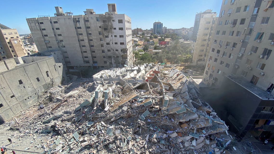 A tower housing AP, Al Jazeera offices collapses after Israeli missile strikes in Gaza city on May 15, 2021. (Reuters)