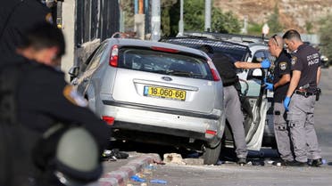 Israeli security forces work at the scene of what police said was a suspected car-ramming attack, at the entrance to Sheikh Jarrah neighbourhood of East Jerusalem May 16, 2021. (Reuters)