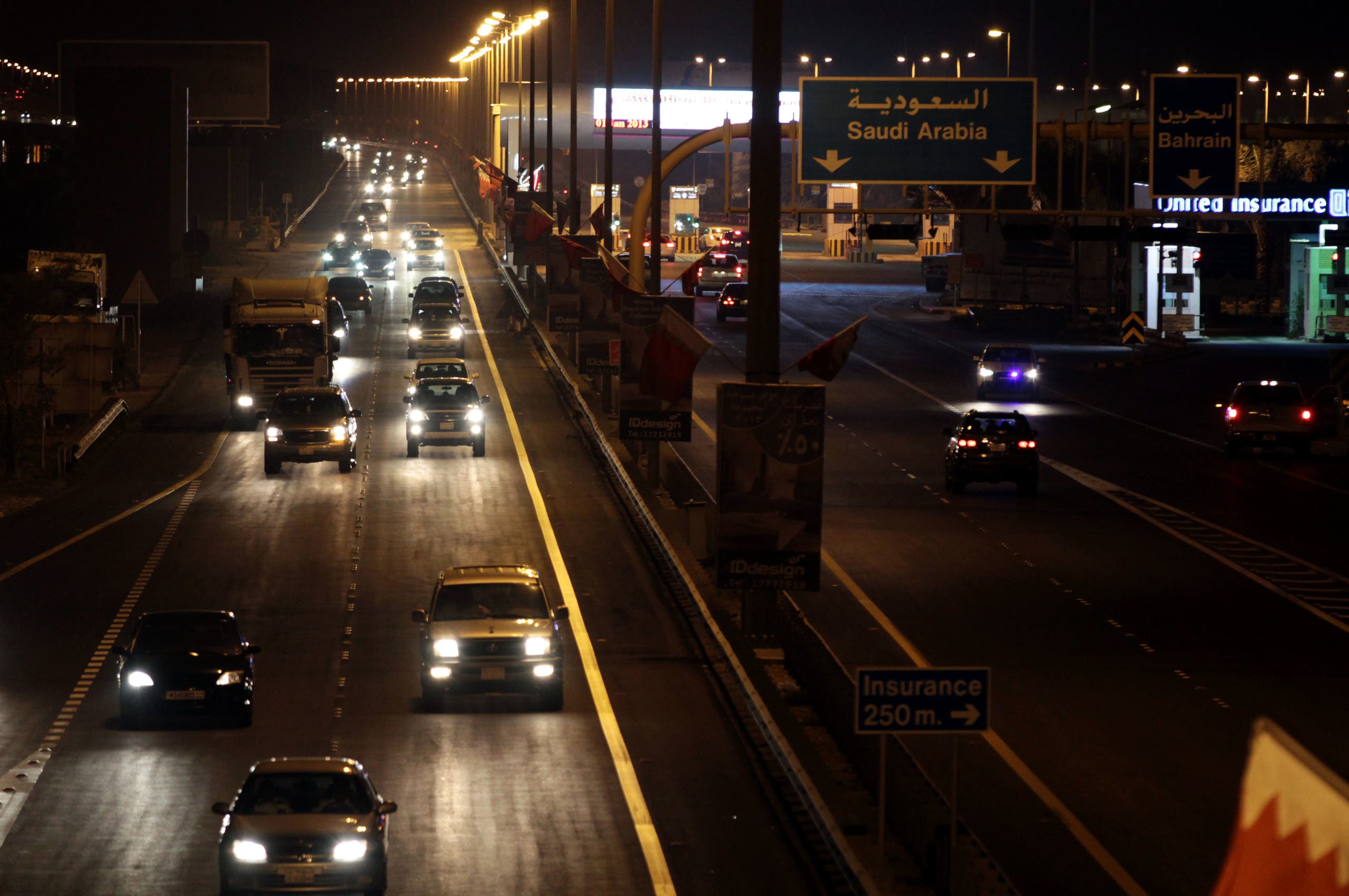 Vehicles travel into Bahrain from Saudi Arabia at King Fahd causeway Tuesday night, Jan. 1, 2013. (AP)